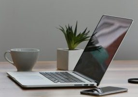 7-Ways-Using-AI-for-Work-Can-Get-Complicated-scaled.jpg Free Minimalist home office desk with laptop, smartphone, and plant for a modern work environment. Stock Photo