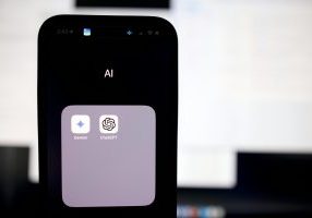 a close up of a cell phone with an ai button